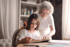 grandparent reading to granddaughter